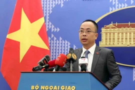 Phó phát ngôn Bộ Ngoại giao Đoàn Khắc Việt chủ trì họp báo thường kỳ tháng 2/2023. (Ảnh: Phạm Kiên/TTXVN)