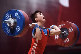 Đô cử Trịnh Văn Vinh là một trong những niềm hy vọng của Thể thao Việt Nam trong cuộc đua giành vé tham dự Olympic Paris 2024. (Ảnh: TTXVN)
