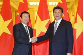 Chủ tịch nước Trung Quốc Tập Cận Bình đón Chủ tịch nước Trương Tấn Sang. (Ảnh: Nguyễn Khang/TTXVN)