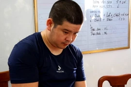 Đối tượng Phạm Hồng Giang tại Cơ quan Công an. (Ảnh: Trung Thực/Vietnam+)