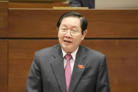 Bộ trưởng Bộ Nội vụ Lê Vĩnh Tân trả lời chất vấn. (Ảnh: Phương Hoa/TTXVN)