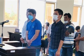 Các bị cáo tại phiên tòa hình sự phúc thẩm. (Ảnh: Tuấn Kiệt/TTXVN)