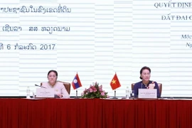 Chủ tịch Quốc hội Việt Nam Nguyễn Thị Kim Ngân và Chủ tịch Quốc hội Lào Pany Yathotou đồng chủ trì hội thảo. (Ảnh: Văn Điệp/TTXVN)