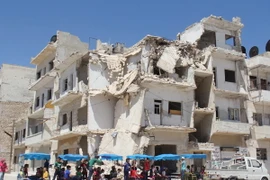 Cảnh đổ nát sau các cuộc giao tranh tại Syria. (Nguồn: AFP/TTXVN)