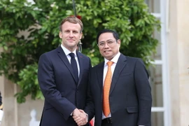 Thủ tướng Chính phủ Phạm Minh Chính và Tổng thống Cộng hòa Pháp Emmanuel Macron. (Ảnh: Dương Giang/TTXVN)