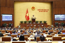 Quốc hội biểu quyết thông qua dự thảo Nghị quyết về phân bổ ngân sách trung ương năm 2022. (Ảnh: Doãn Tấn/TTXVN)