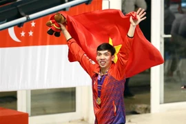 Vận động viên Nguyễn Huy Hoàng giành Huy chương Vàng nội dung 200m bơi bướm nam với thành tích 1 phút 58 giây 81. (Ảnh: TTXVN)
