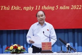 Chiều 11/5, tại thành phố Thủ Đức, Chủ tịch nước Nguyễn Xuân Phúc và đoàn đại biểu Quốc hội Thành phố Hồ Chí Minh tiếp xúc cử tri tại thành phố Thủ Đức. (Ảnh: Thống Nhất/TTXVN)