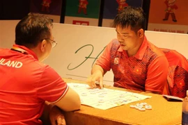 Tuyển thủ Nguyễn Minh Nhật Quang tham gia thi đấu nội dung Cờ đồng đội nam. (Ảnh: Hoàng Ngọc/TTXVN)