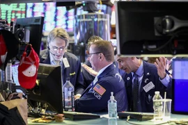 Giao dịch viên tại Sàn giao dịch chứng khoán New York, Mỹ. (Nguồn: THX/TTXVN)