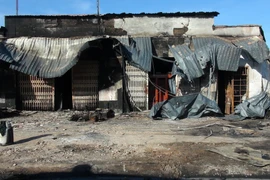 Vụ cháy đã khiến 6 người thiệt mạng, 15 căn nhà bị thiêu rụi. (Ảnh: Đậu Tất Thành/TTXVN)