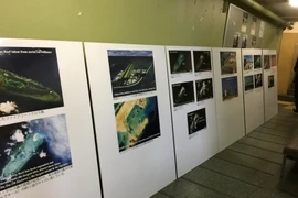 Các bức ảnh tại triển lãm. (Nguồn: Vietnam+)