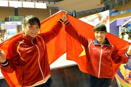 Phạm Thị Huệ và Phạm Thi Loan giành 2 huy chương vàng cho Việt Nam. (Ảnh: Thanh Hà/TTXVN)