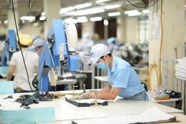 Đổi mới công nghệ, tăng năng suất lao động trong ngành dệt may. (Ảnh: Đức Duy/Vietnam+)