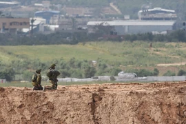 Binh sỹ Israel xung đột với người biểu tình Palestine ở Dải Gaza. (Nguồn: THX/ TTXVN)