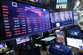 Bảng tỷ giá chứng khoán tại Sàn giao dịch chứng khoán New York, Mỹ. (Nguồn: THX/TTXVN)