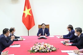 Thủ tướng Phạm Minh Chính điện đàm với ông John Kerry, Đặc phái viên của Tổng thống Mỹ. (Ảnh: Dương Giang/TTXVN) 