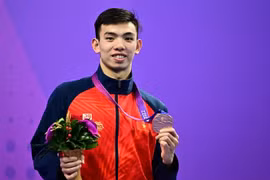 "Kình ngư" Nguyễn Huy Hoàng giành huy chương Đồng nội dung Bơi 400m Tự do Nam tại ASIAD 2023 ở Hàng Châu, Trung Quốc ngày 29/9/2023. (Ảnh: AFP/TTXVN)