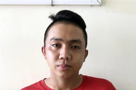 Đối tượng Phạm Nhật Quang tại cơ quan công an. (Ảnh: TTXVN phát) 
