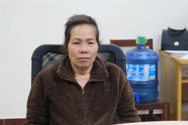 Đối tượng Hoàng Thúy Vân tại cơ quan điều tra. (Ảnh: TTXVN phát)