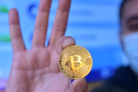 Đồng tiền kỹ thuật số bitcoin. (Nguồn: AFP/TTXVN) 