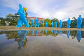 Hậu Giang diễn tập phòng, chống COVID-19 tại cụm công nghiệp. (Ảnh: Duy Khương/TXTVN)