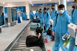 Đội tuyển Việt Nam trở về nước hôm 17/6 sau khi tạo nên kỳ tích với lần đầu dự vòng loại thứ ba World Cup. (Ảnh: TTXVN) 