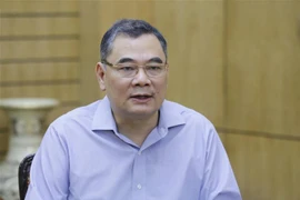 Thiếu tướng Tô Ân Xô, Chánh Văn phòng, Người Phát ngôn của Bộ Công an, trao đổi với phóng viên của Thông tấn xã Việt Nam. (Ảnh: Doãn Tấn/TTXVN) 