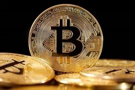 Đồng tiền kỹ thuật số bitcoin. (Ảnh: Getty Images/TTXVN)