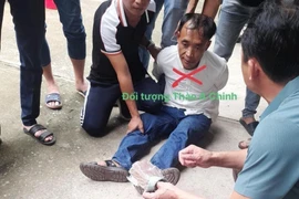 Đối tượng Thào A Chinh bị bắt giữ. (Ảnh: TTXVN phát) 