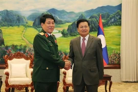 Tổng Bí thư, Chủ tịch nước Lào Thongloun Sisoulith tiếp Đại tướng Lương Cường cùng đoàn đến chào xã giao tại Văn phòng Trung ương Đảng Nhân dân Cách mạng Lào ở thủ đô Vientiane. (Ảnh: Phạm Kiên/TTXVN) 