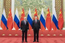 Tổng thống Nga Vladimir Putin (trái) và Chủ tịch Trung Quốc Tập Cận Bình (phải) tại cuộc gặp ở Bắc Kinh ngày 4/2/2022. (Ảnh: THX/TTXVN) 