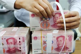 Đồng 100 Nhân dân tệ của Trung Quốc. (Ảnh: AFP/TTXVN)