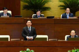 Bộ trưởng Bộ Giao thông vận tải Nguyễn Văn Thể trả lời chất vấn nhóm vấn đề về lĩnh vực giao thông vận tải. (Ảnh: Minh Đức/TTXVN) 