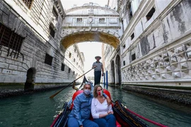 Đi thuyền tại Venice, Italy. (Nguồn: AFP/TTXVN) 
