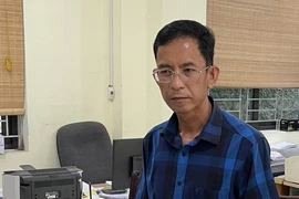 Nông Văn Cán, Phó phòng Kinh tế Hạ tầng huyện Nguyên Bình tại cơ quan điều tra. (Ảnh: TTXVN phát)