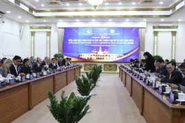 Lãnh đạo Thành phố Hồ Chí Minh với Hiệp hội Thương mại Hoa Kỳ tại Việt Nam. (Ảnh: Xuân Anh/TTXVN)