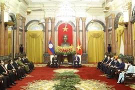 [Photo] Chủ tịch nước Nguyễn Xuân Phúc tiếp Thủ tướng Lào