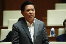 Bộ trưởng Bộ Giao thông Vận tải Nguyễn Văn Thể giải trình làm rõ các vấn đề có liên quan. (Ảnh: Minh Đức/TTXVN) 