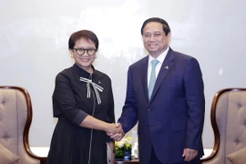 Thủ tướng Phạm Minh Chính tiếp Bộ trưởng Ngoại giao Indonesia Retno Marsudi. (Ảnh: Dương Giang/TTXVN)