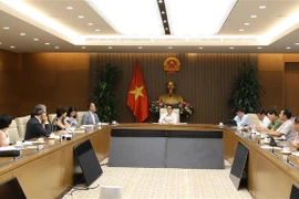 Phó Thủ tướng Vũ Đức Đam chủ trì cuộc họp. (Ảnh: Văn Điệp/TTXVN) 