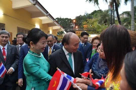 Chủ tịch nước Nguyễn Xuân Phúc gặp gỡ kiều bào tại Thái Lan. (Ảnh: Huy Tiến/TTXVN) 