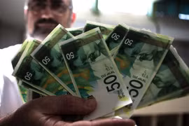Đồng tiền mệnh giá 50 shekel của Israel. (Ảnh: AFP/TTXVN)