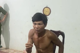 Đối tượng Sắc bị công an bắt giữ. (Ảnh: TTXVN phát)