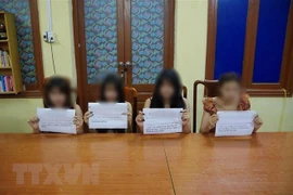 Các đối tượng tại cơ quan Công an tỉnh Tuyên Quang. (Nguồn: TTXVN phát) 