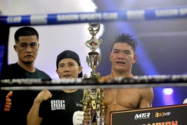 Võ sỹ Trần Quốc Tuấn thi đấu và giành chiến thắng ở hạng cân 68kg. (Ảnh: Thành Chung/Vietnam+)