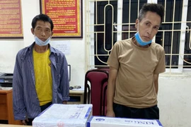 Vàng A Hù và Vàng A Mua tại cơ quan điều tra. (Nguồn: An ninh Thủ đô) 