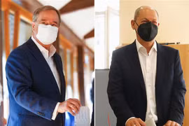 Lãnh đạo đảng Dân chủ Xã hội Đức (SPD) Olaf Scholz (phải) bỏ phiếu bầu Quốc hội ở Potsdam và lãnh đạo Liên minh Dân chủ/Xã hội Cơ đốc giáo (CDU/CSU) Armin Laschet bỏ phiếu tại điểm bầu cử ở Aachen, ngày 26/9/2021. (Ảnh: AFP/TTXVN) 