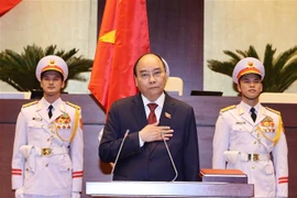 Chủ tịch nước Nguyễn Xuân Phúc tuyên thệ nhậm chức. (Ảnh: Thống Nhất/TTXVN)
