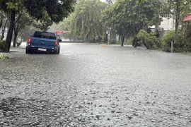 Mưa to gây ngập úng cục bộ một số khu dân cư tập trung tại thành phố Tam Kỳ, tỉnh Quảng Nam. (Ảnh Trần Tĩnh/TTXVN)